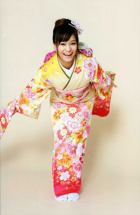 Beautiful gravure idol dressed in a bright and colorful kimono