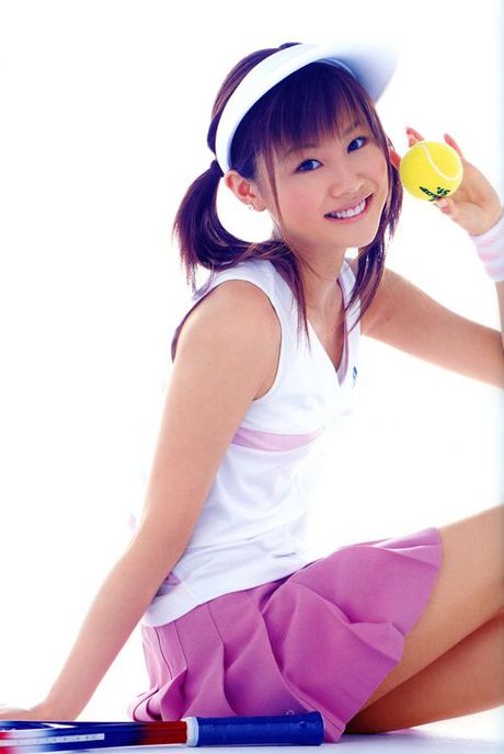 Cute asian girl is flirtatious with her long hair in a dress