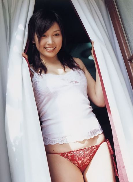 Seductive asian fox in a bikini with big soft round titties