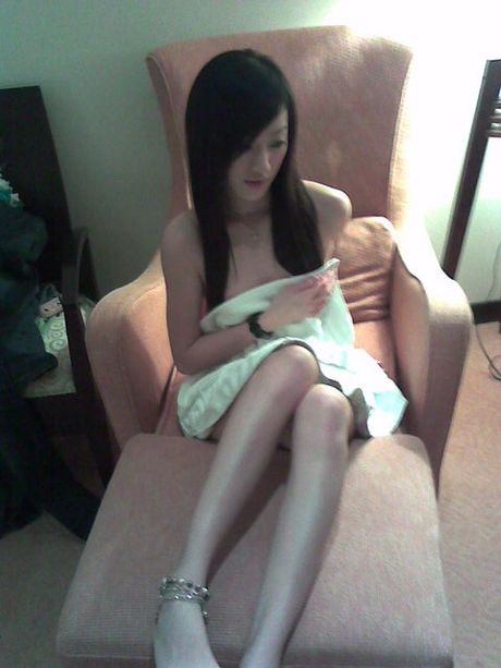 Two Asian girls posing nude in a hotel room