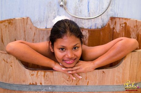 Indian Asha Kumara oiled and soaking wet in the shower
