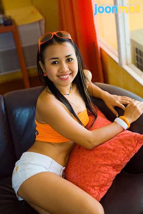 Asian cutie slides down orange sunglasses white booty shorts