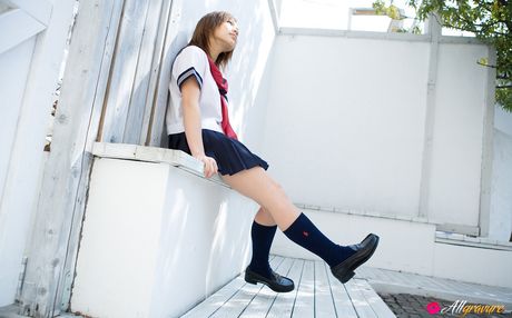Runa Hamakawa Asian plays with her uniform skirt after classes
