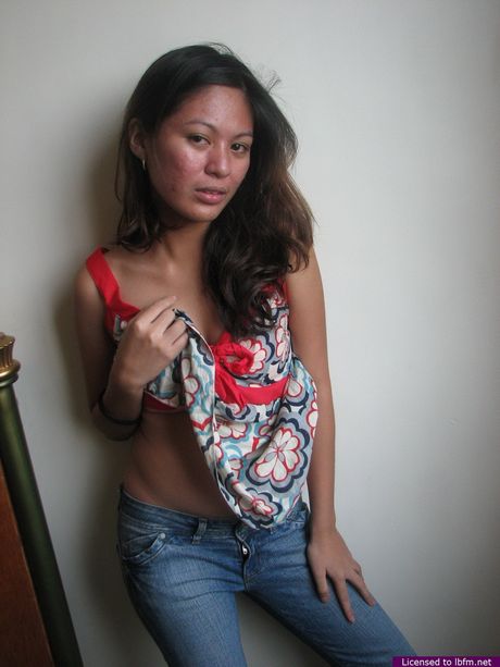 Asian amateur chick with tiny tits strips and shows her hairy cunt