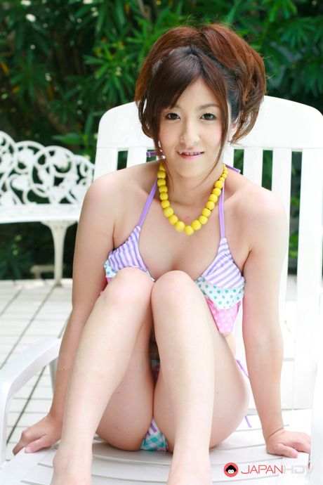 Wonderful sweet Japanese lady relaxing by the pool and showing off